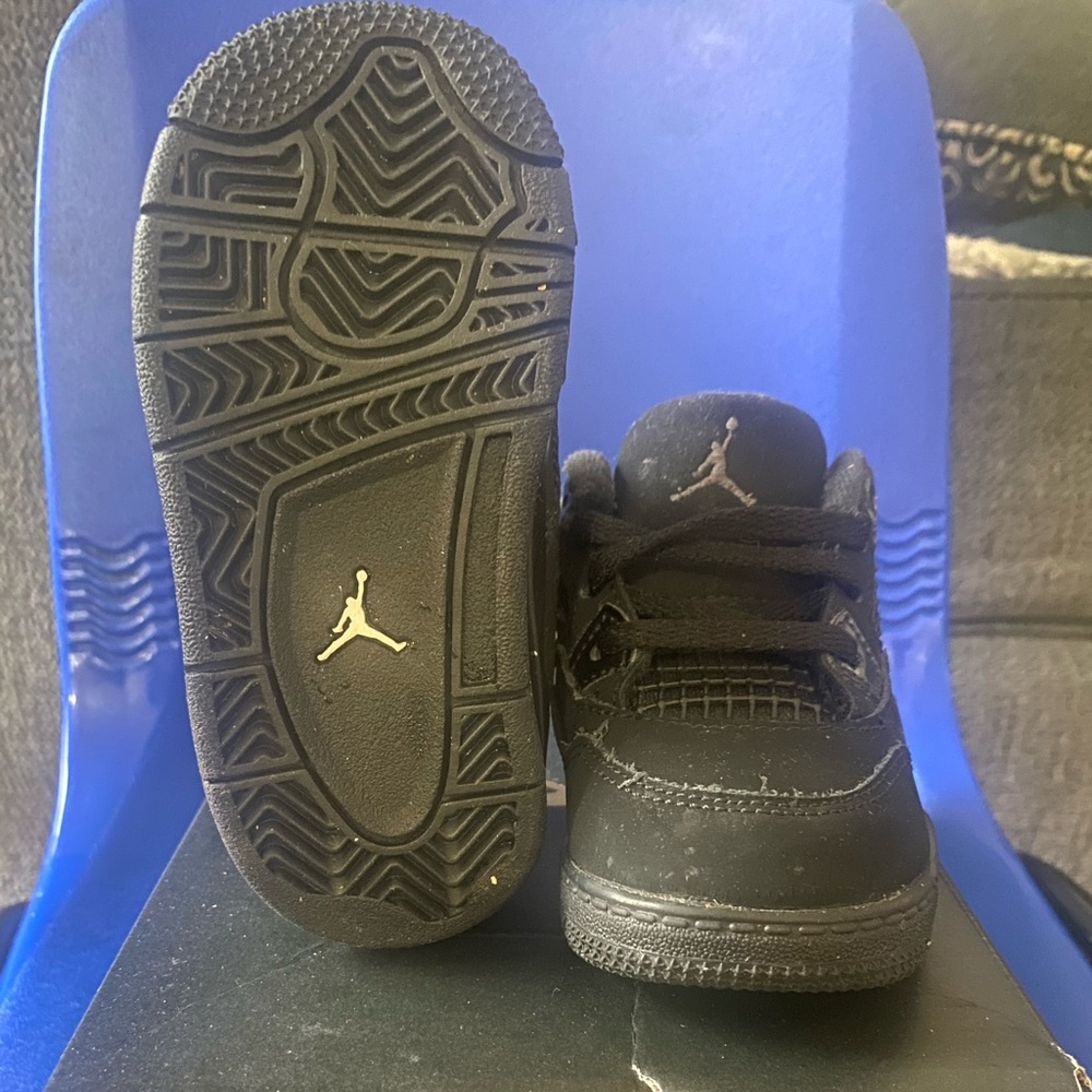 All black number 4 baby Jordan’s